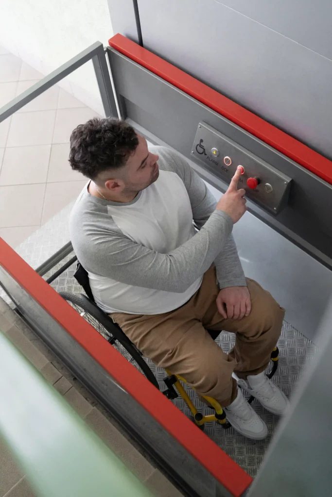 Vertical stair lift with a young man in the vertical stair lift.